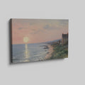 Framed canvas print of an Impressionist seascape with a sunset over the ocean and coastal village