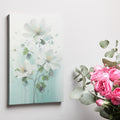 Framed canvas print of hand-painted style white flowers on a pastel background