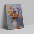 Framed canvas print of vibrant impasto flowers in a vase with rich textures