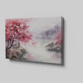 Framed canvas print of a watercolour cherry blossom landscape with figures and traditional architecture