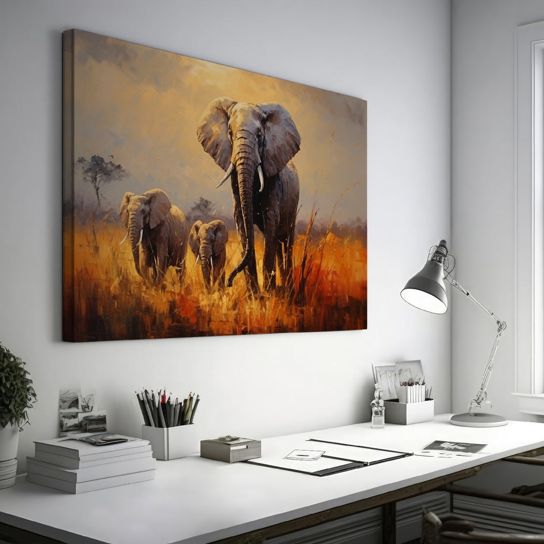 Framed canvas print of a family of elephants in a vibrant, golden savannah sunset