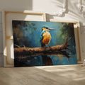 Framed canvas print of a Kingfisher bird with vibrant blue and orange plumage, perched on a branch over reflective water