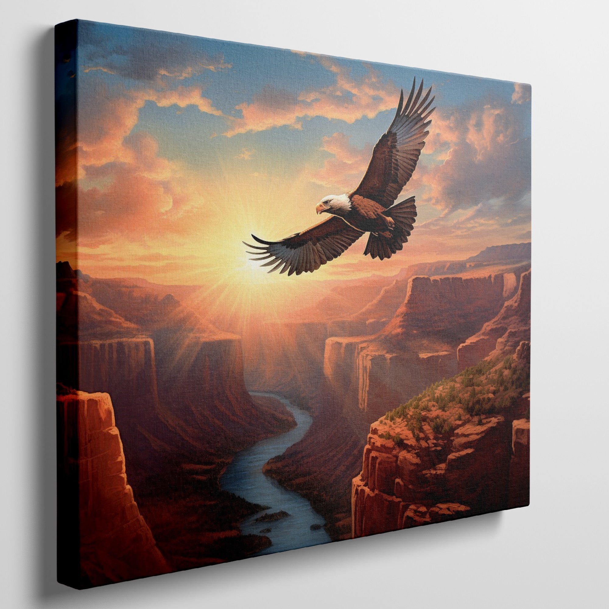 Framed canvas print of a majestic eagle flying over a sunset-lit river canyon