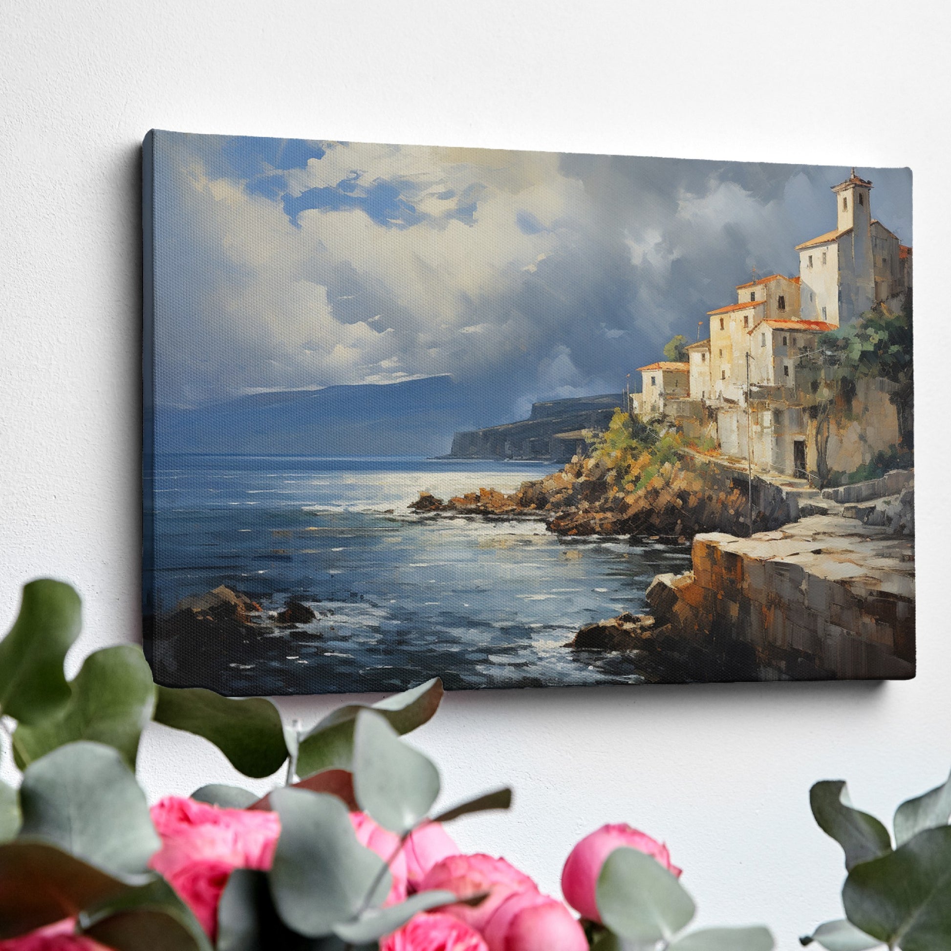 Framed canvas print of a realistic painting depicting a cliffside Mediterranean village with vivid blue sea and sky