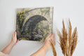 Framed canvas print of a rustic stone bridge with ivy in watercolour style