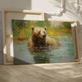 Framed canvas print of an impressionistic painting of a brown bear in a tranquil river setting with lush greenery