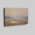 Framed canvas print of a misty countryside meadow with a sunrise and soft pastel colours