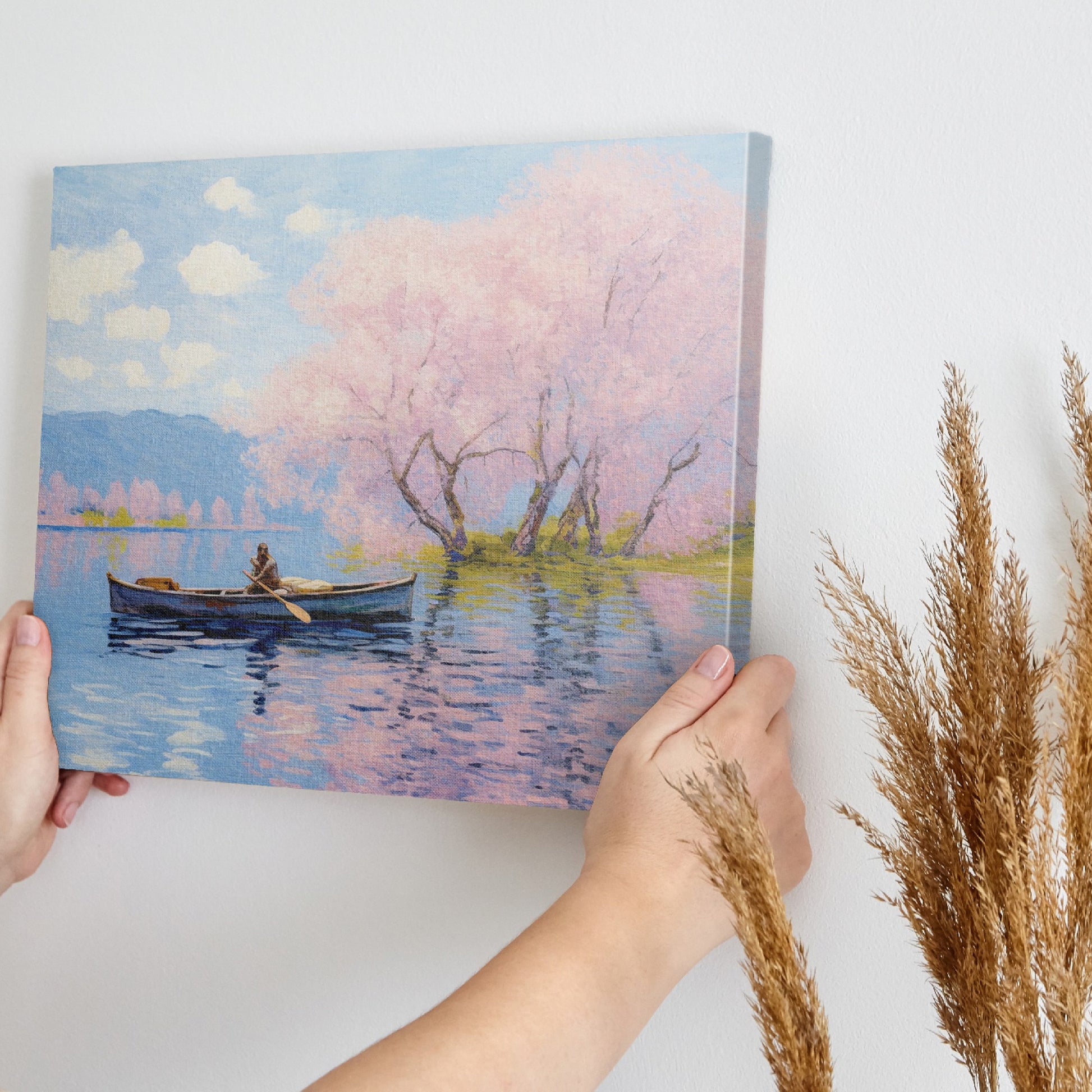 Framed canvas print of Impressionist-style cherry blossoms over a lake with a rowboat