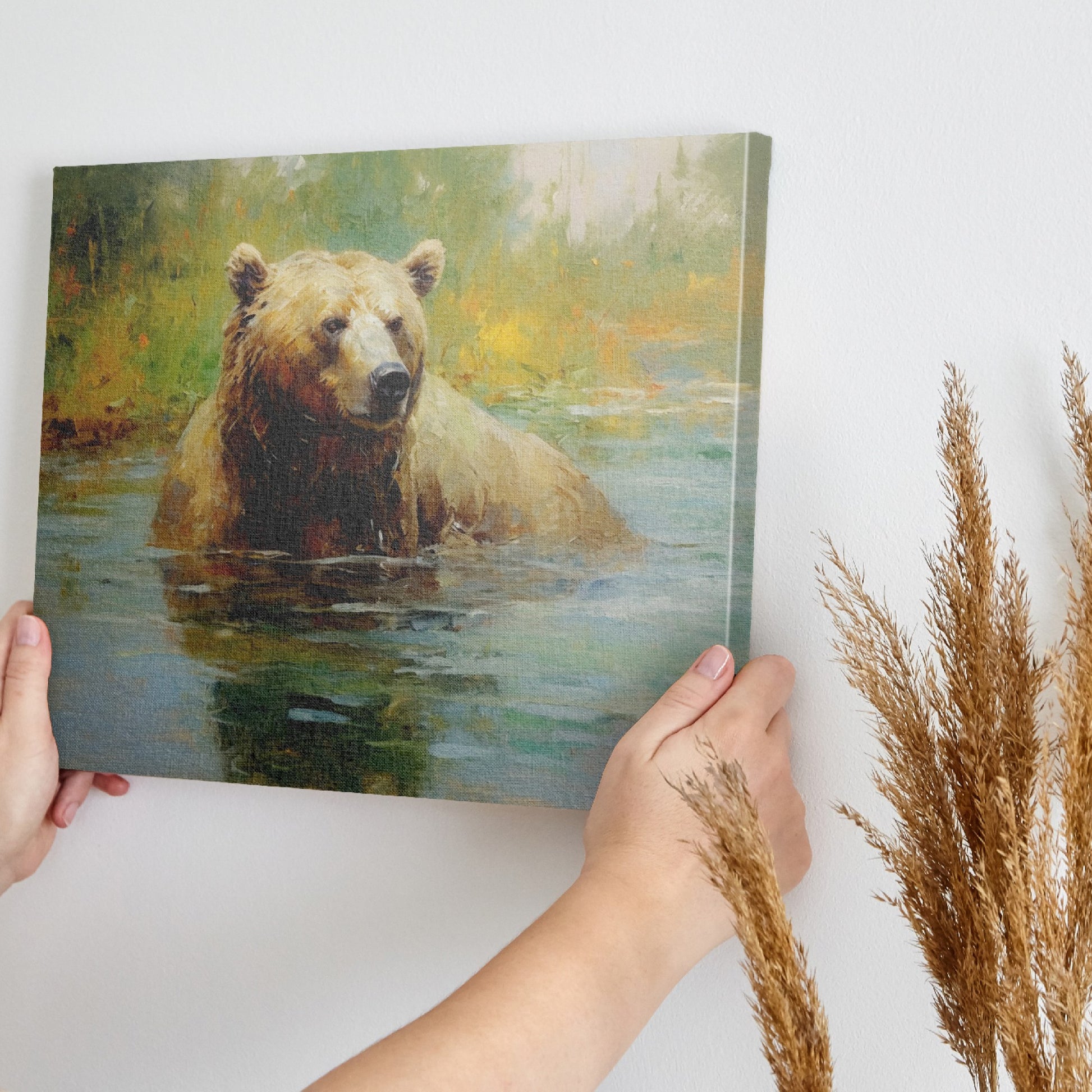 Framed canvas print of an impressionistic painting of a brown bear in a tranquil river setting with lush greenery