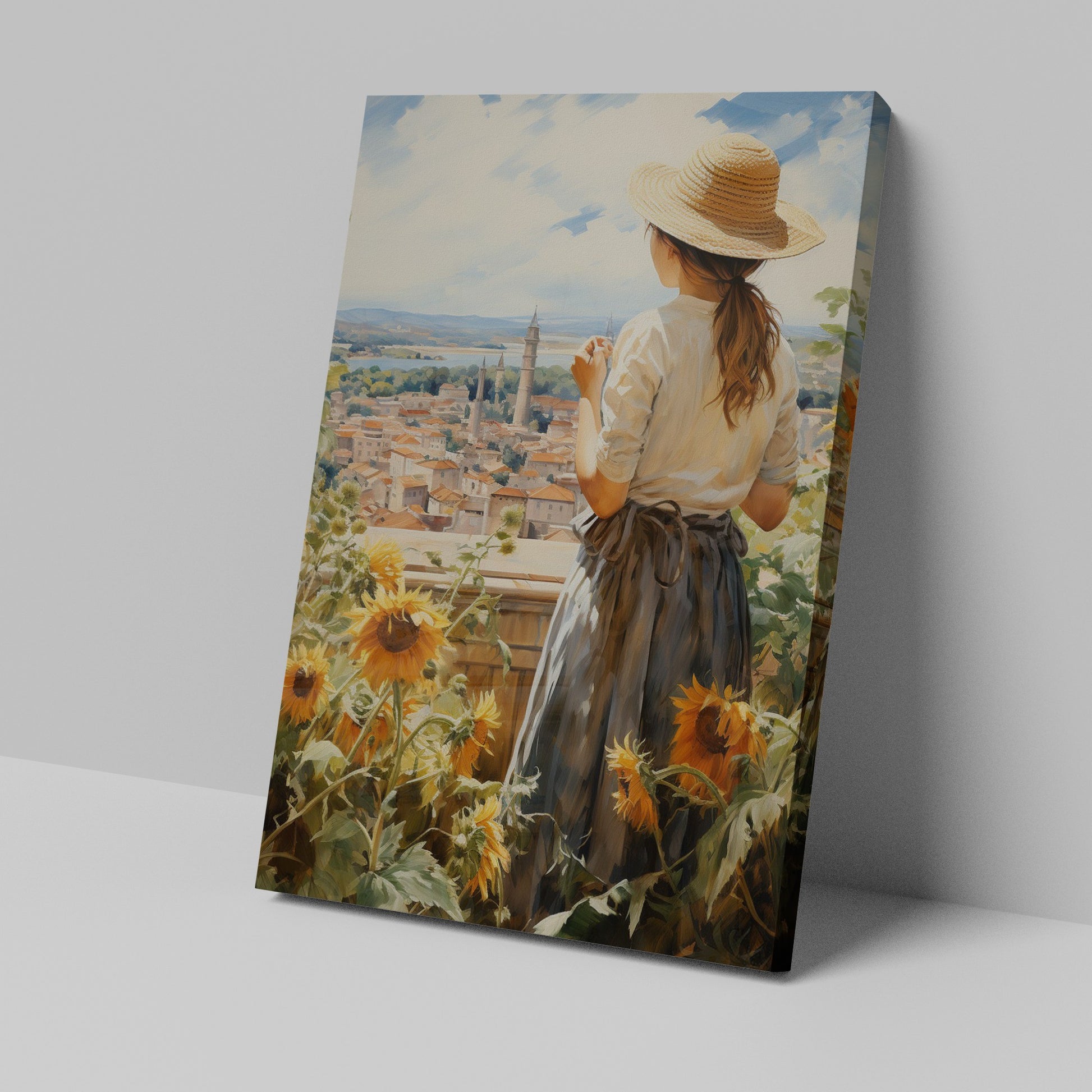 Framed canvas print of a woman gazing over a sunflower field and vintage town