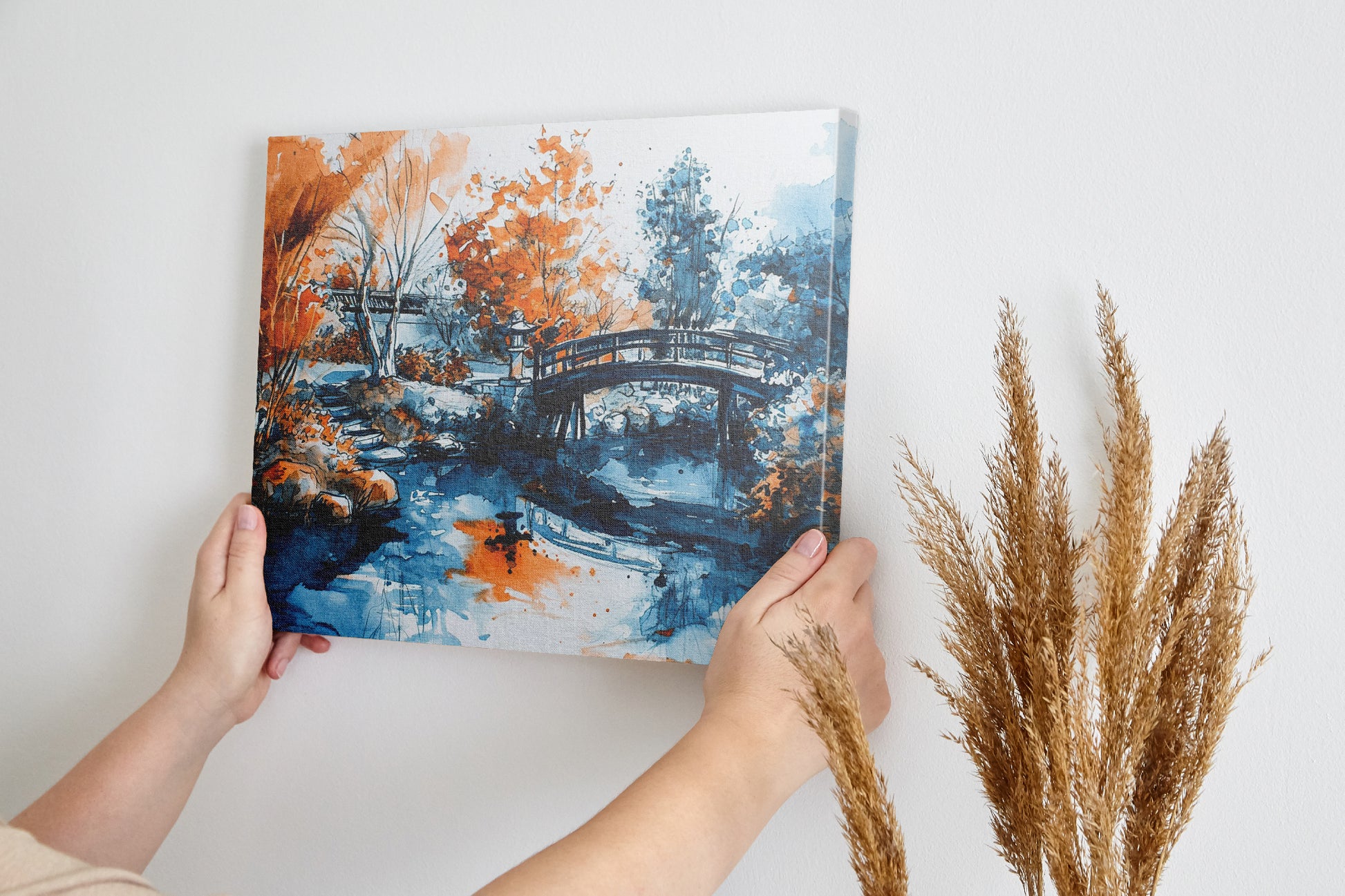 Framed canvas print of an Oriental garden scene with a bridge over water in autumnal hues of orange and blue