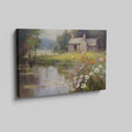 Framed canvas print of a rustic cottage by a peaceful lake with wildflowers in the foreground