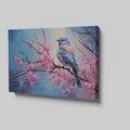 Framed canvas print of a bluebird perched on cherry blossom branches, with vibrant blue and pink hues