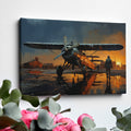 Framed canvas print of a vintage biplane at sunset with pilot walking and the aircraft's reflection on the wet ground