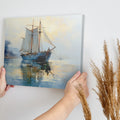 Framed canvas print of tranquil dawn light with an elegant sailing ship reflecting in the ocean