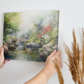 Framed canvas print of a serene Japanese garden with a bridge, waterfall, and flowers