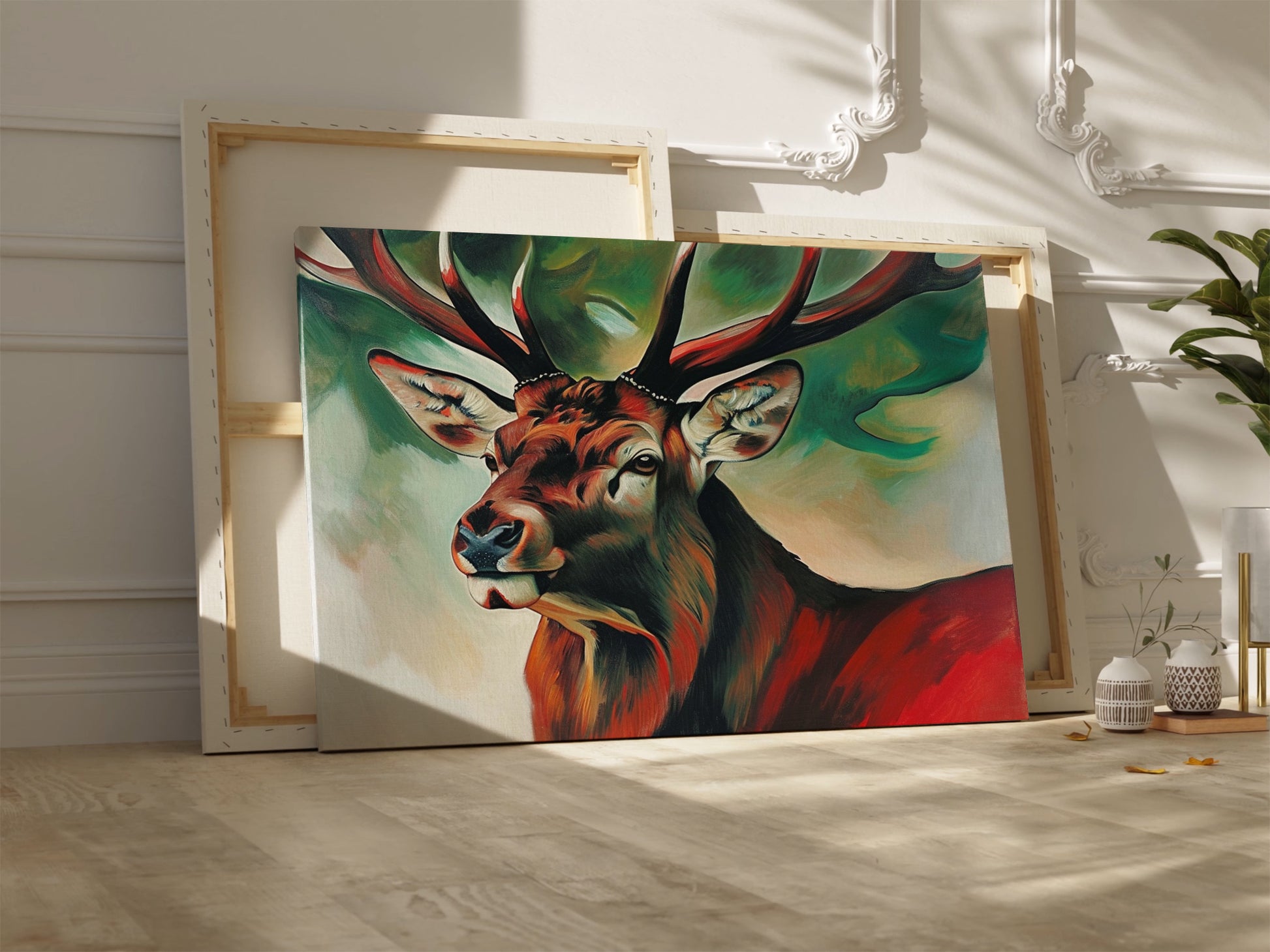 Framed canvas print of an expressive stag portrait with vibrant reds and abstract green background