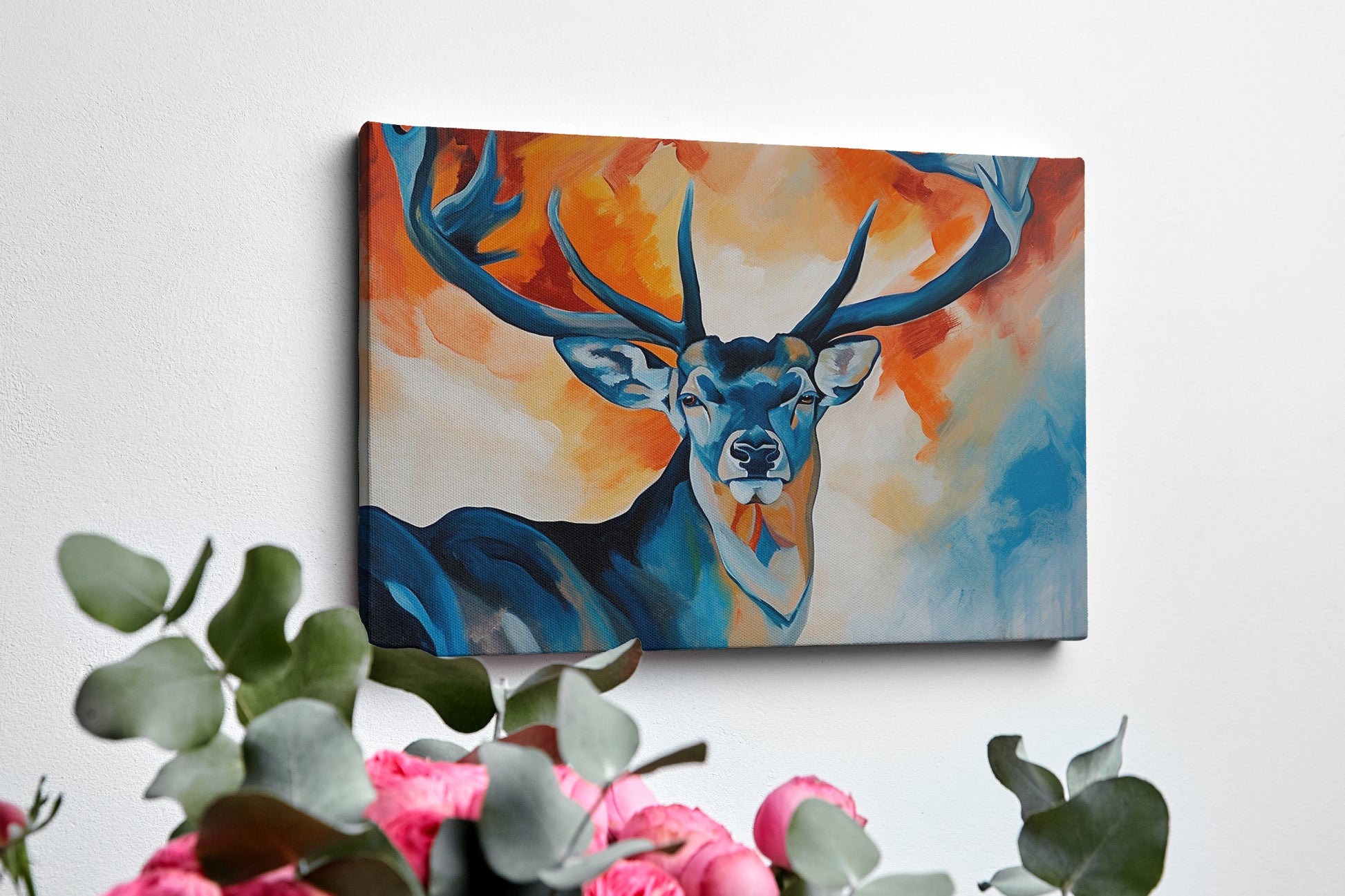 Framed canvas print of a stylized stag with abstract blue and orange background