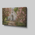 Framed canvas print of a chapel surrounded by lush pink blossom trees