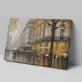 Framed canvas print of a Parisian streetscape with autumn leaves and rain