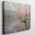 Framed canvas print of a tranquil river landscape featuring blooming cherry blossoms and a boat, in Impressionist style