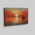 Framed canvas print of a sailboat silhouetted against a sunset with warm red and orange tones