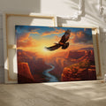 Framed canvas print of a majestic eagle flying over a sunset-lit river canyon