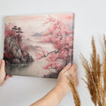 Framed canvas print of Oriental landscape with cherry blossoms and misty mountains