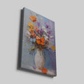 Framed canvas print of vibrant impasto flowers in a vase with rich textures