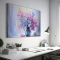 Framed canvas print of a realistic floral still life with pastel pink and blue flowers in a vase