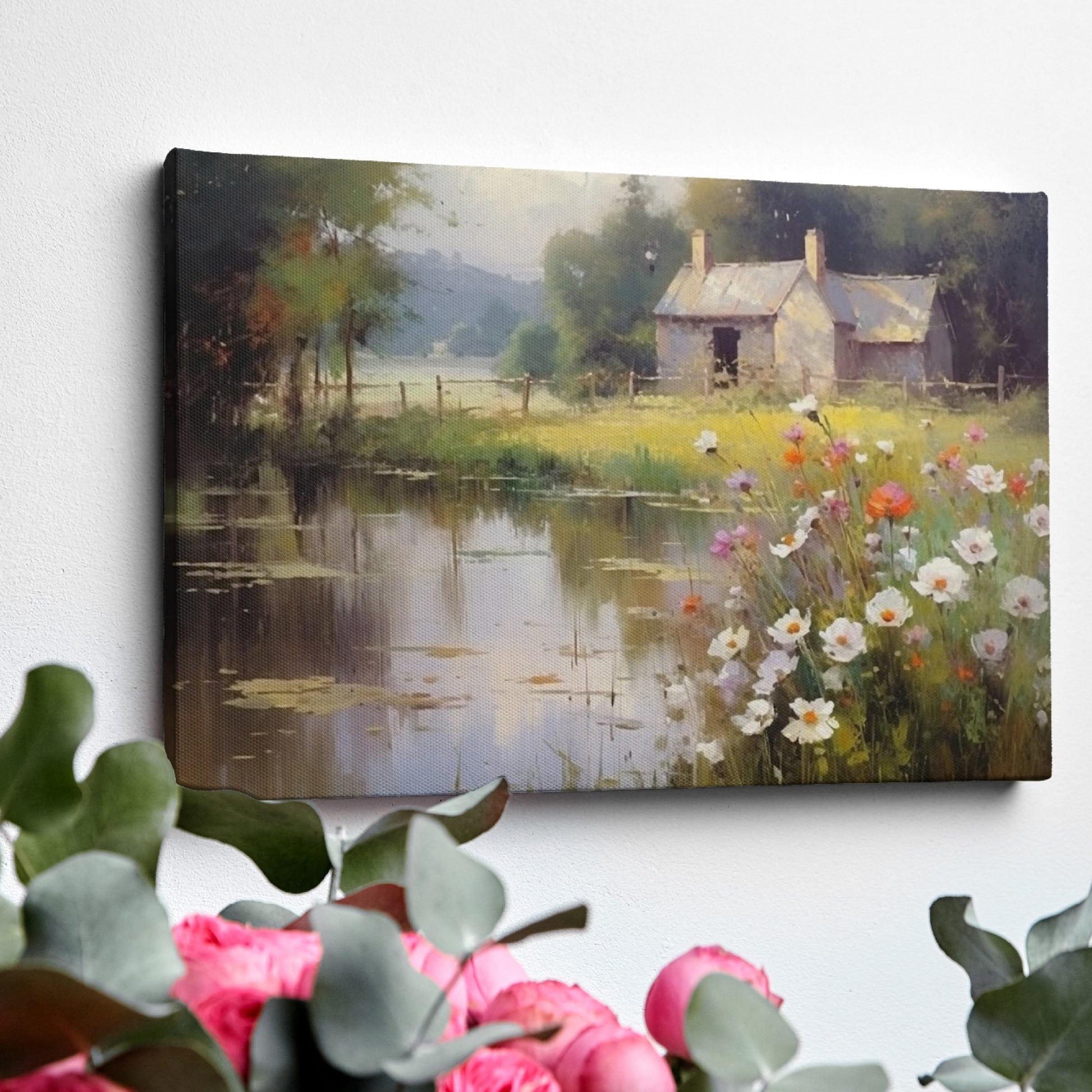 Framed canvas print of a rustic cottage by a peaceful lake with wildflowers in the foreground