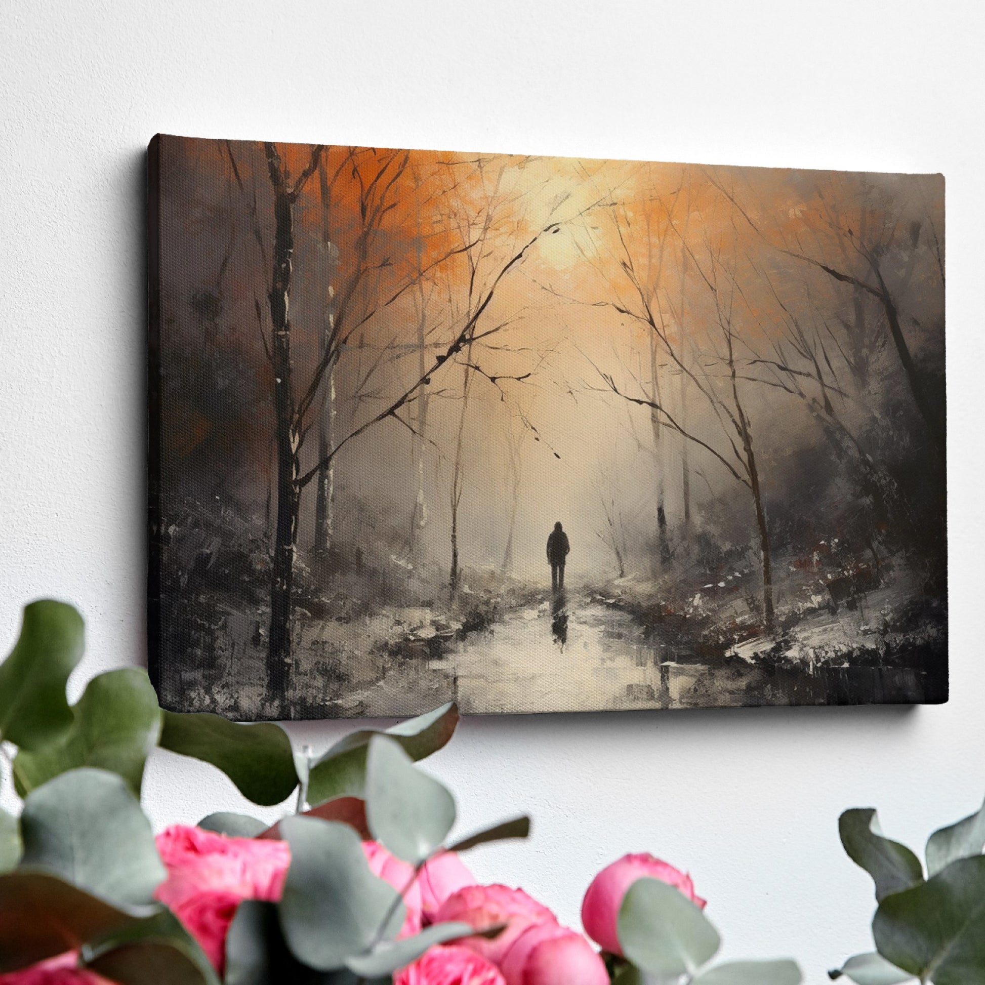 Framed canvas print of a solitary figure walking through a misty, autumnal forest with warm, glowing light