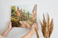 Framed canvas print of a charming English village scene with watercolour cottages in a rustic countryside setting