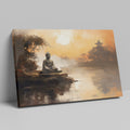 Framed canvas print of a serene Buddha statue at sunset with oriental temple and reflective water