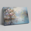 Framed canvas print of impressionist painting with blossoming trees by a serene lake