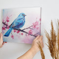 Framed canvas print of a bluebird and cherry blossoms in pastel watercolour