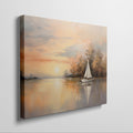 Framed canvas print of a sailboat during sunset with golden sky and water reflections