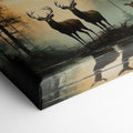 Framed canvas print of deer silhouetted against a forest sunset with reflections on water