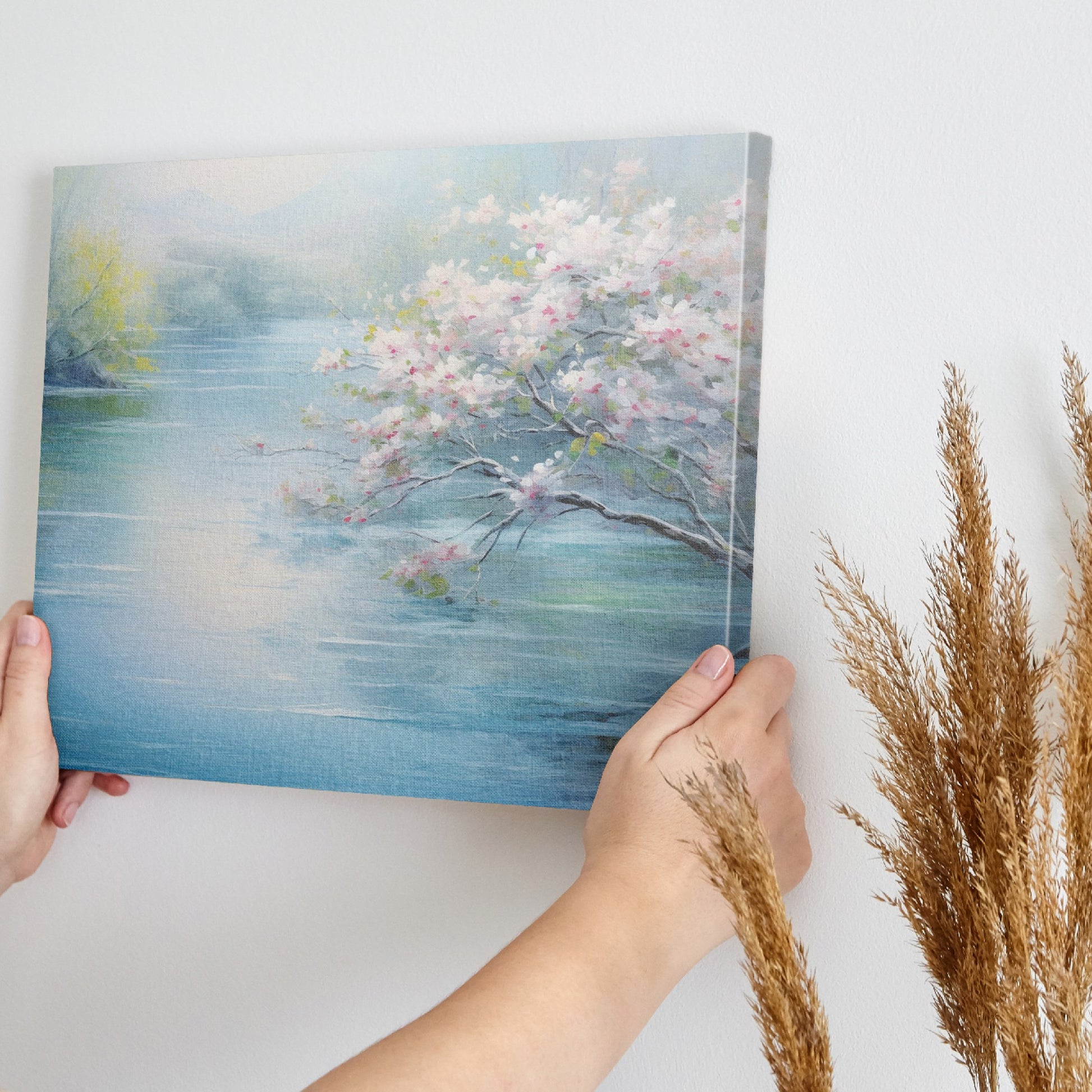 Framed canvas print of serene riverscape with cherry blossoms in impressionist style