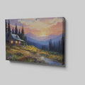 Framed canvas print of a rustic cabin at sunset with a mountainous backdrop