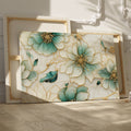 Framed canvas print of abstract turquoise and ivory flowers with gold trim