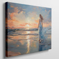 Framed canvas print of a woman in an elegant dress at sunset on a beach, with vibrant reflection in water