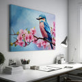 Framed canvas print of a colourful bird on a blossoming cherry branch