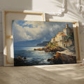 Framed canvas print of a realistic painting depicting a cliffside Mediterranean village with vivid blue sea and sky