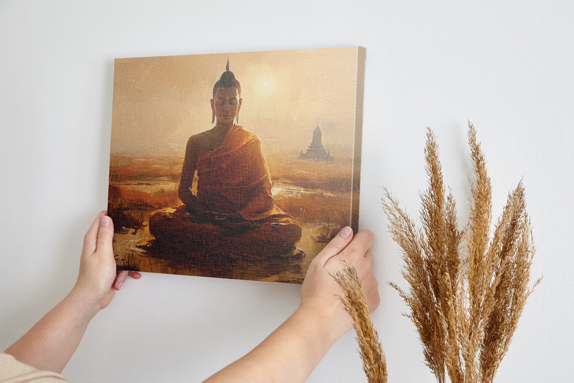 Framed canvas print of a serene meditating Buddha in golden sunset hues with temple silhouette