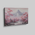 Framed canvas print of serene mountain landscape with pink cherry blossoms and mist