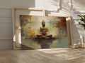 Framed canvas print of a serene Buddha in meditation with an abstract, earth-toned backdrop and reflective water