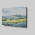 Framed canvas print of a Tuscan landscape with watercolor rolling hills and a village