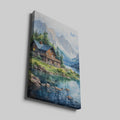 Framed canvas print of a serene lake cabin with mountain backdrop