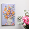 Framed canvas print of vibrant impasto-style floral bouquet with textured vase